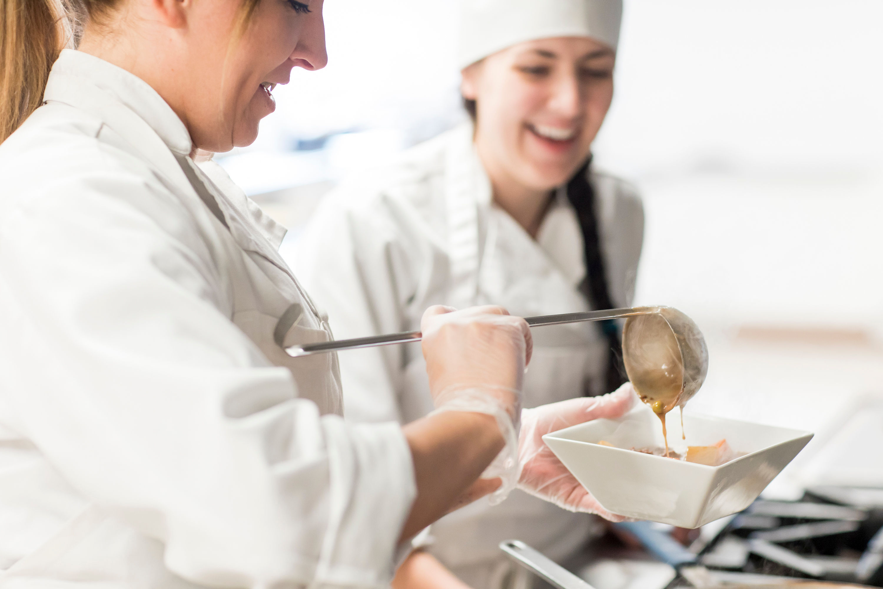 Culinary students at SMCC practice plating dishes